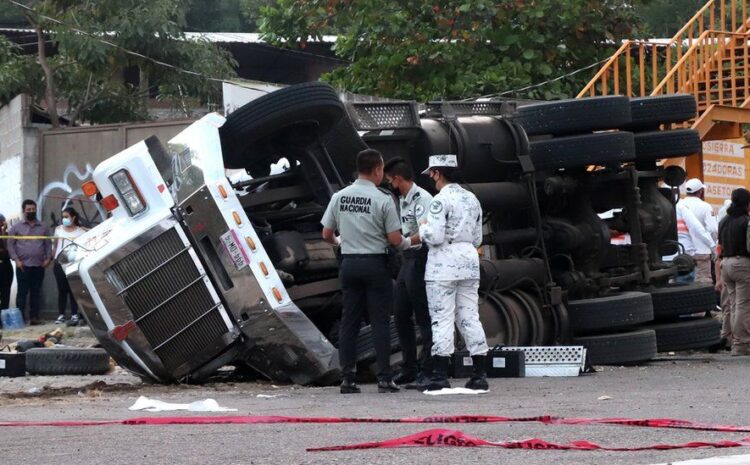 Mexico truck crash: At least 54 people killed as trailer overturns